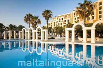 The outdoor swimming pool of the Hilton in St Julians, Malta